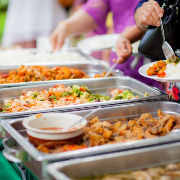 Food Buffet Catering Dining Eating Party Sharing Concept.people group catering buffet food indoor in luxury restaurant with meat colorful fruits and vegetables